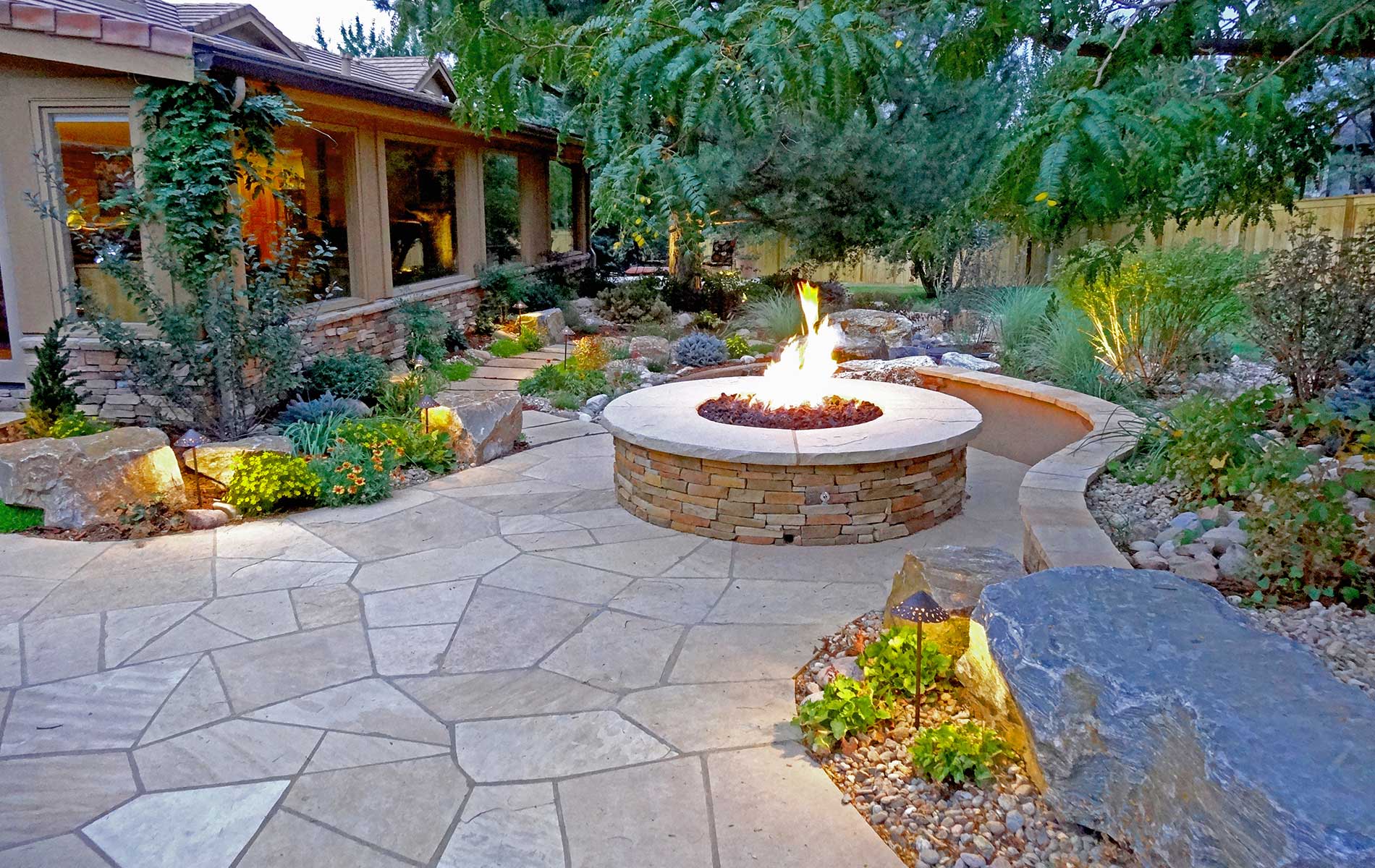 Irregular Flagstone Patio and Stone Fire Feature in Rustic Ranch in Greenwood Village Mile High Landscaping in Denver