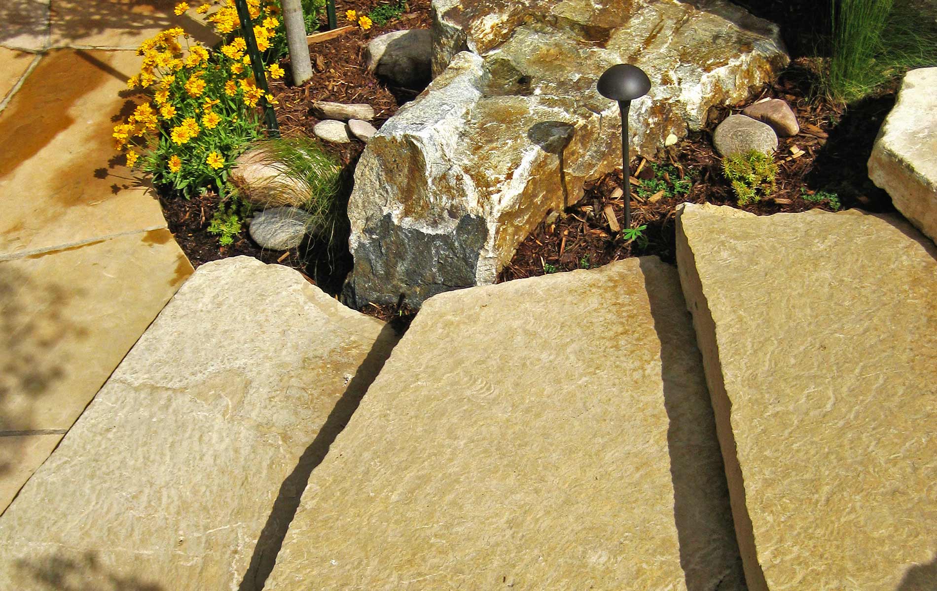 custom slab staircase wraps gold ore boulders